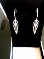 Diamond drop feather earrings.